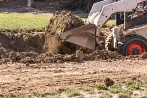 skid steer loading dirt