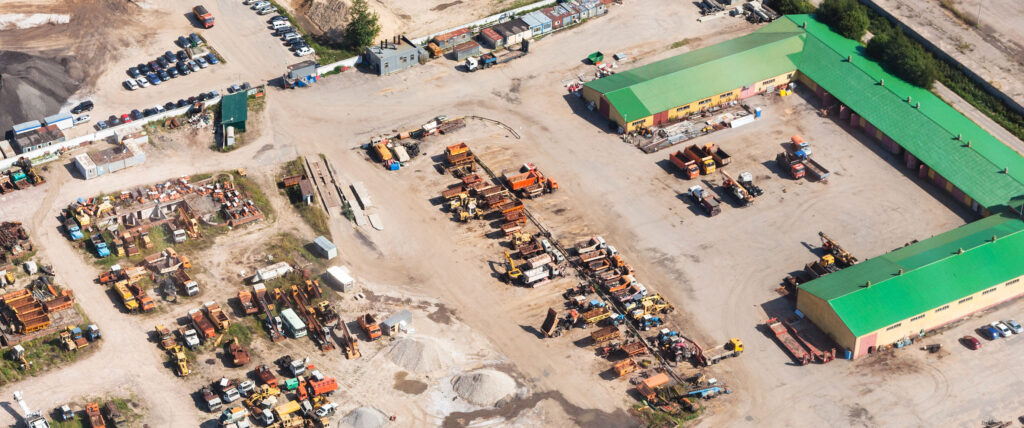 an aerial photo of a yard full of rental equipment and trucks